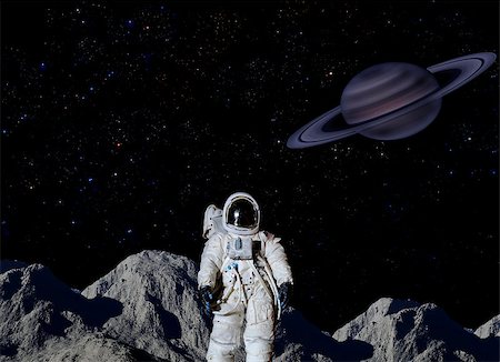 Astronaut on surface of Saturn's moon. Stock Photo - Budget Royalty-Free & Subscription, Code: 400-07613762