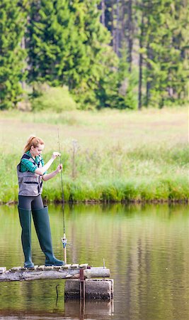 simsearch:400-07501738,k - young woman fishing on pier at pond Photographie de stock - Aubaine LD & Abonnement, Code: 400-07613838