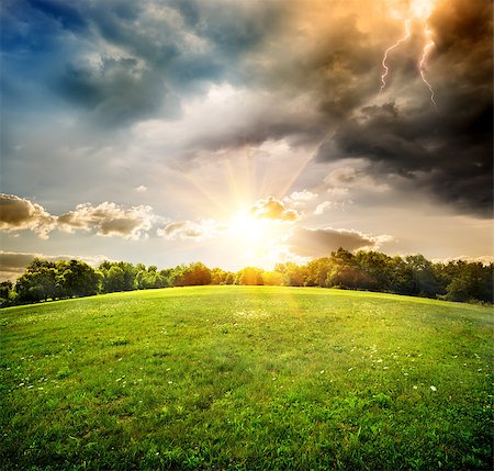 storm sun - Bright lightning over the field and forest Stock Photo - Budget Royalty-Free & Subscription, Code: 400-07624404