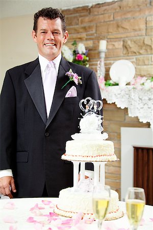 simsearch:400-04741437,k - Handsome groom standing beside the wedding cake at his gay wedding, waiting for his husband. Stock Photo - Budget Royalty-Free & Subscription, Code: 400-07624441