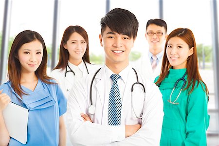 simsearch:400-07412761,k - Professional medical doctor team standing over white background Foto de stock - Royalty-Free Super Valor e Assinatura, Número: 400-07624484