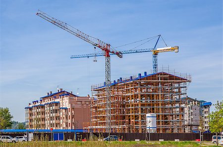 View of cranes and new modern residential buildings on construction site in Alba, Italy. Stock Photo - Budget Royalty-Free & Subscription, Code: 400-07625134