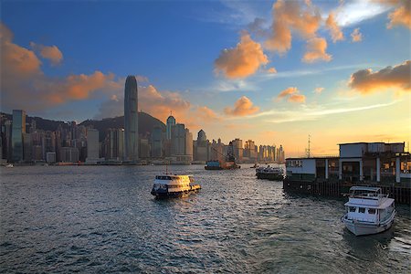 southeast asia skyline ferris - Hong Kong Island Central City Skyline from Kowloon Ferry Pier Along Victoria Harbor Sunset Stock Photo - Budget Royalty-Free & Subscription, Code: 400-07625562