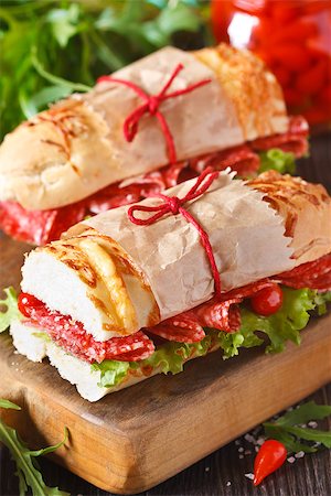 simsearch:400-07792940,k - Tasty salami sandwiches on a cooking board close-up. Stock Photo - Budget Royalty-Free & Subscription, Code: 400-07626103