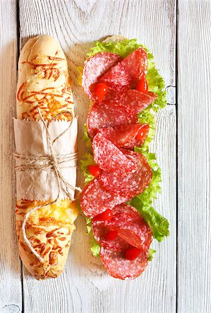 simsearch:400-07792940,k - Salami sandwich with lettuce and sweety drop peppers on a white wooden board. Stock Photo - Budget Royalty-Free & Subscription, Code: 400-07626119