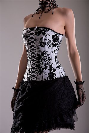 simsearch:400-07549730,k - Elegant young woman in black and white corset, studio shot Stock Photo - Budget Royalty-Free & Subscription, Code: 400-07626249