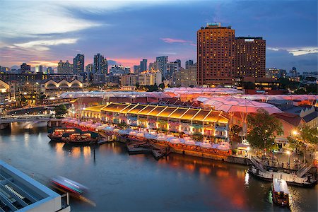 restaurant district - CLARKE QUAY, SINGAPORE - MAY 24, 2014: Clarke Quay lights up at dusk after sunset along Singapore River. Clarke Quay is a popular tourist spot for food, entertainment, and nightlife along with catching the bumboat rides along SIngapore River. Stock Photo - Budget Royalty-Free & Subscription, Code: 400-07626304