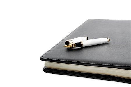 notebook and pen in composition on white background Stock Photo - Budget Royalty-Free & Subscription, Code: 400-07626432