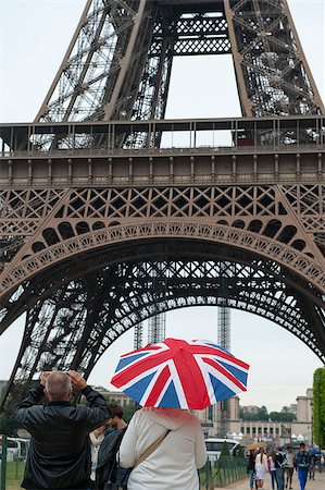 paris umbrella - english tourists in paris photographing the eiffel tower Stock Photo - Budget Royalty-Free & Subscription, Code: 400-07626510