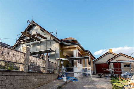 Construction or repair of the rural house, fixing facade, insulation and using color Stock Photo - Budget Royalty-Free & Subscription, Code: 400-07627035