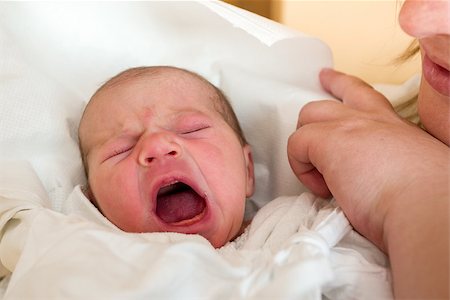 pictures of crying newborn babies - crying newborn baby in the hospital - the first hours of the new life Stock Photo - Budget Royalty-Free & Subscription, Code: 400-07627038