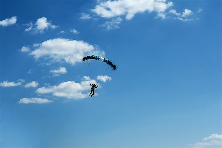 simsearch:846-03163644,k - silhouette of unidentified one skydiver on blue sky Stock Photo - Budget Royalty-Free & Subscription, Code: 400-07627039