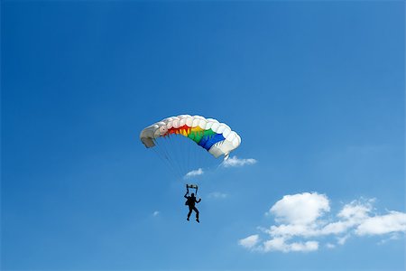 simsearch:846-03163644,k - silhouette of unidentified one skydiver on blue sky Stock Photo - Budget Royalty-Free & Subscription, Code: 400-07627040