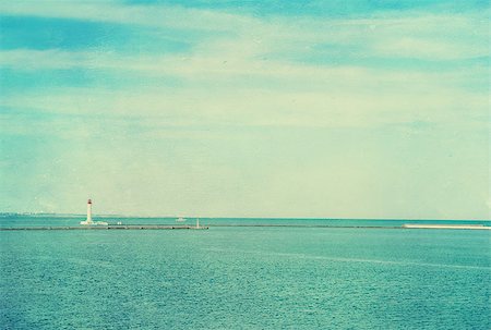 Vintage photo of lighthouse tower. Nautical texture background with a lighthouse for the retro concept of sea vacation. Stock Photo - Budget Royalty-Free & Subscription, Code: 400-07627227