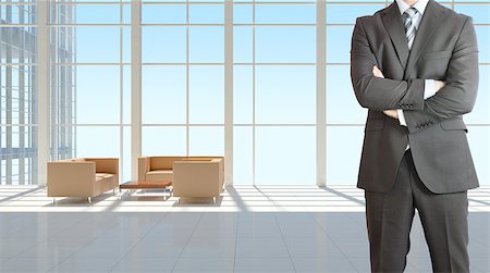 Businessman wearing a suit. Large window in office building as background Stock Photo - Budget Royalty-Free & Subscription, Code: 400-07627406