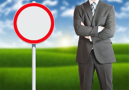 simsearch:400-07919003,k - Businessman with road sign. Blue sky and green grass as backdrop Stock Photo - Budget Royalty-Free & Subscription, Code: 400-07627427