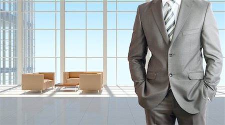 Businessman wearing a suit. Large window in office building as background Stock Photo - Budget Royalty-Free & Subscription, Code: 400-07627435