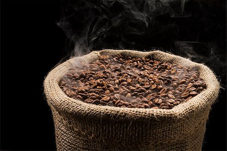 simsearch:659-08904383,k - Sack full of still hot, freshly roasted coffee beans with the smoke rising in the air. Fotografie stock - Microstock e Abbonamento, Codice: 400-07627458