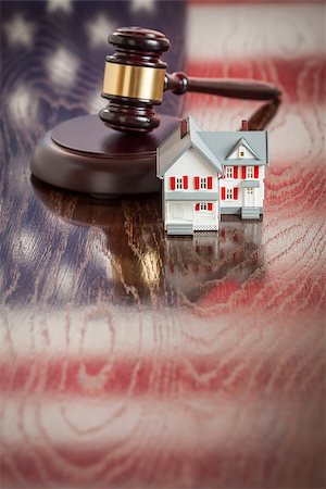 eviction - Small House and Gavel on Wooden Table with American Flag Reflection. Stock Photo - Budget Royalty-Free & Subscription, Code: 400-07627645