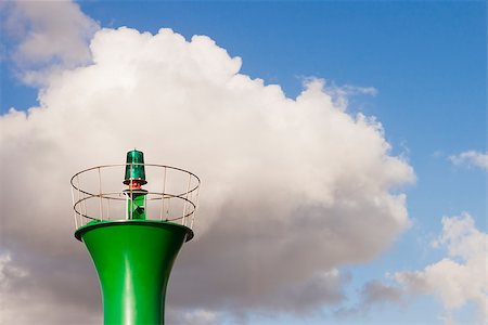 photojope (artist) - Green beacon top light against a blue sky with white clouds. Photographie de stock - Aubaine LD & Abonnement, Code: 400-07627797