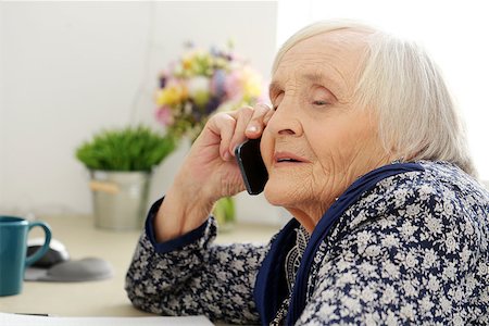 Close-up. Cute, elderly woman with mobile phone Stock Photo - Budget Royalty-Free & Subscription, Code: 400-07627824