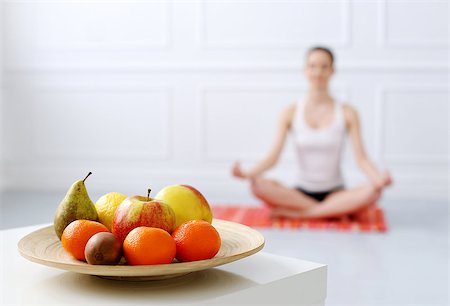 Lifestyle. Cute, attractive woman during yoga exercise Fotografie stock - Microstock e Abbonamento, Codice: 400-07627852