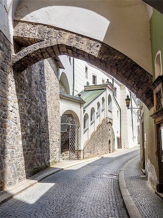 passau - Narrow street Passau, Germany, a street with cobblestones in Summer. Fotografie stock - Microstock e Abbonamento, Codice: 400-07628315