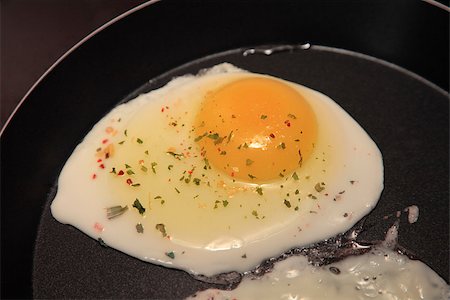 Raw Egg on the Frying Pan, Close Up Stock Photo - Budget Royalty-Free & Subscription, Code: 400-07628861