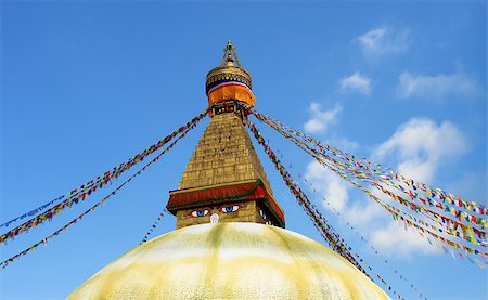 bodhnath stupa in kathmandu with buddha eyes and prayer flags on clear blue sky background Stock Photo - Budget Royalty-Free & Subscription, Code: 400-07629166