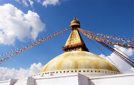 bodhnath stupa in kathmandu with buddha eyes and prayer flags on clear blue sky background Stock Photo - Budget Royalty-Free & Subscription, Code: 400-07629172