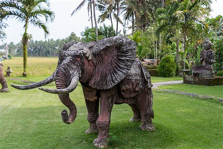 Realistic naturalistic elephant statue standing on a lawn at a park or landscaped garden in Bali Stock Photo - Budget Royalty-Free & Subscription, Code: 400-07629559