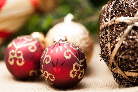 Christmas background with colourful shiny red and gold Xmas baubles with handcrafted straw ornaments and decorations tied with red ribbon for seasonal wishes Stock Photo - Budget Royalty-Free & Subscription, Code: 400-07629730