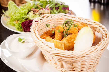 simsearch:400-05708291,k - Crispy fried crumbed chicken nuggets in a wicker basket served as a finger food or appetizer with a creamy dip in a bowl alongside Stock Photo - Budget Royalty-Free & Subscription, Code: 400-07629999