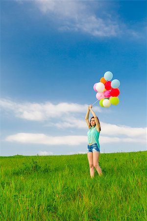 simsearch:400-08262183,k - Young beautiful woman with colorful balloons on a green meadow Stock Photo - Budget Royalty-Free & Subscription, Code: 400-07620005