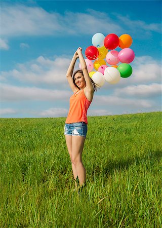 simsearch:400-06077546,k - Young beautiful woman with colorful balloons on a green meadow Stockbilder - Microstock & Abonnement, Bildnummer: 400-07620001