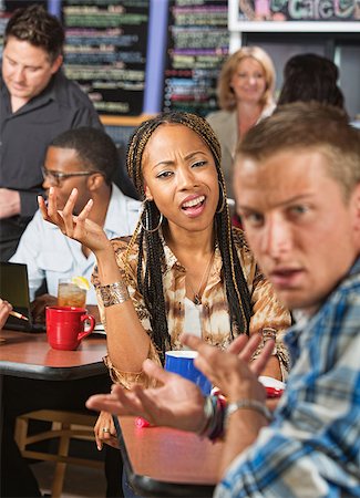 simsearch:400-08815869,k - Mixed Black and white couple arguing in a cafe Photographie de stock - Aubaine LD & Abonnement, Code: 400-07620057