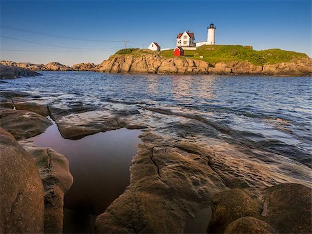 simsearch:6129-09086658,k - The Nuble lighthouse at sunset as seen from shore in York, Maine, USA Stockbilder - Microstock & Abonnement, Bildnummer: 400-07620316