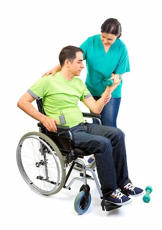 Physical therapist works with patient in lifting hands weights. Young adult in wheelchair. Foto de stock - Super Valor sin royalties y Suscripción, Código: 400-07620321