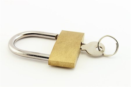 photoestelar (artist) - Onr key attached to a golden padlock. Isolated on a white background. Stock Photo - Budget Royalty-Free & Subscription, Code: 400-07620977