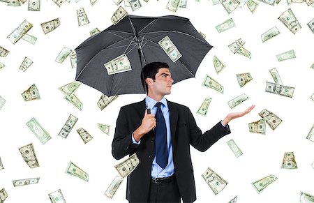 Stock image of businessman with umbrella and falling money Foto de stock - Super Valor sin royalties y Suscripción, Código: 400-07620992