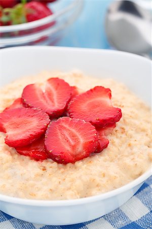 porridge and berries - Healthy homemade oatmeal with strawberries for breakfast Stock Photo - Budget Royalty-Free & Subscription, Code: 400-07621147