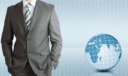 simsearch:400-09011393,k - Businessman in a suit with background of Earth and figures. Business concept Photographie de stock - Aubaine LD & Abonnement, Code: 400-07621339