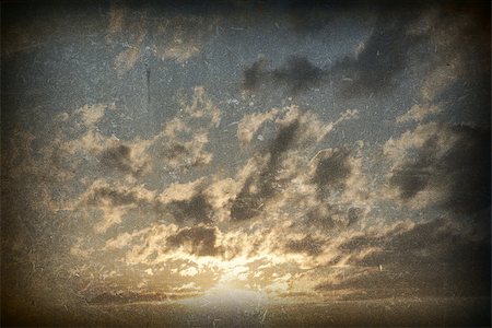 Evening blue sky. Clouds and sunset gold color. Grunge style Stock Photo - Budget Royalty-Free & Subscription, Code: 400-07621344