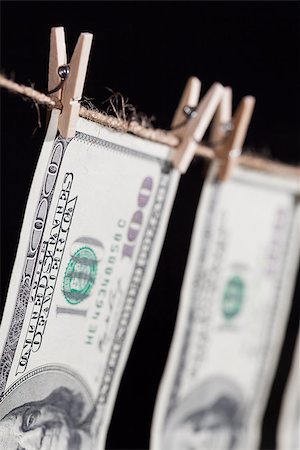 simsearch:640-02656364,k - Hundred Dollar Bills Hanging From a Clothesline on a Dark Background. Stock Photo - Budget Royalty-Free & Subscription, Code: 400-07621357