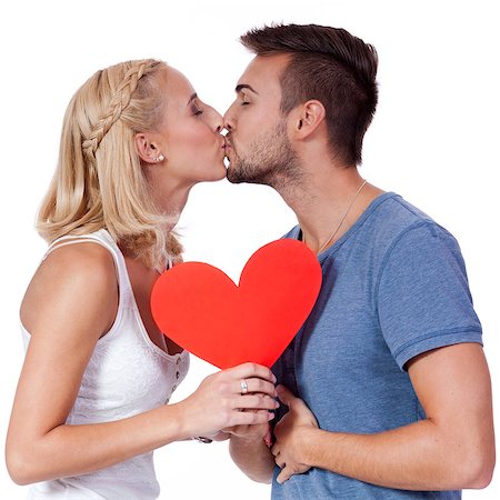 happy young couple in love with red heart valentines day isolated  portrait Foto de stock - Super Valor sin royalties y Suscripción, Código: 400-07622401