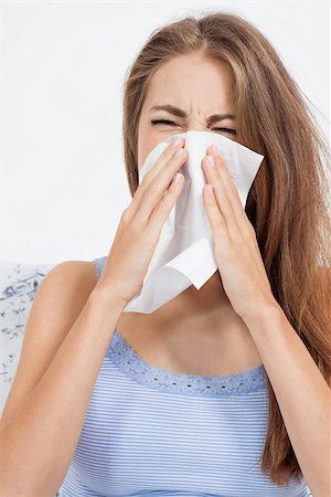 young brunette woman with flu cold influenza portrait at home Stock Photo - Budget Royalty-Free & Subscription, Code: 400-07622444