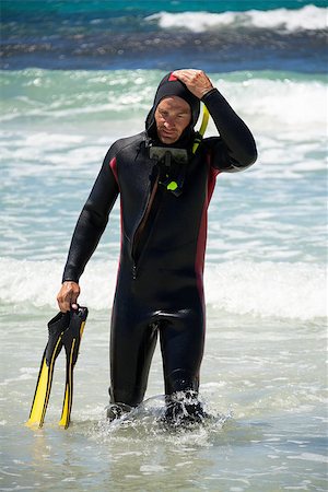 simsearch:400-04007432,k - male diver with diving suit snorkel mask fins on the beach in Summer Stock Photo - Budget Royalty-Free & Subscription, Code: 400-07622537