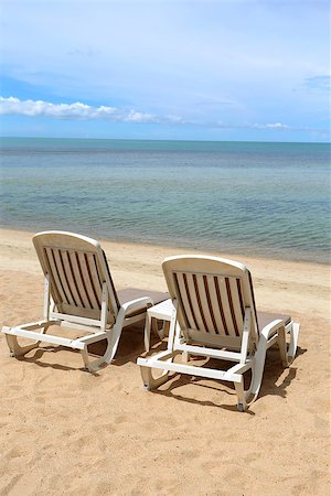 simsearch:400-07622541,k - lovely white lounge chairs on the sea beach Stock Photo - Budget Royalty-Free & Subscription, Code: 400-07622542