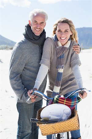 Carefree couple going on a bike ride and picnic on the beach  on a bright but cool day Stock Photo - Budget Royalty-Free & Subscription, Code: 400-07622732