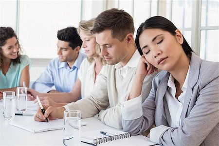 Casual businesswoman falling asleep during meeting in the office Stock Photo - Budget Royalty-Free & Subscription, Code: 400-07622881